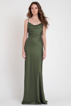 a woman in a long green dress