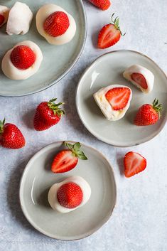 three plates with desserts and strawberries on them