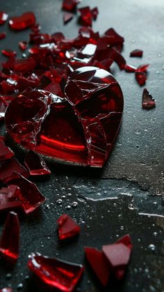 broken red glass hearts on the ground