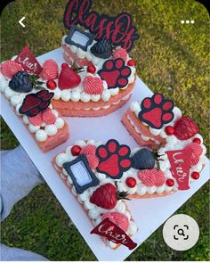 three heart shaped cakes with dog paw prints on them