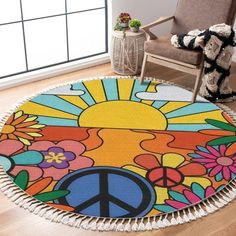 a peace sign rug is on the floor next to a chair