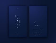 two dark blue business cards on a black background