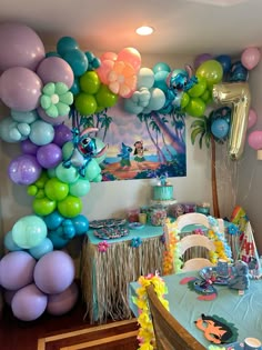 a room filled with lots of balloons and decorations