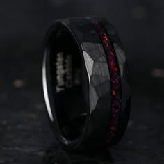 a black ring with red and blue inlays