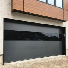 a modern garage door in front of a building