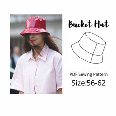 a woman wearing a pink hat with the words, bucket hat sewing pattern size 556 - 622