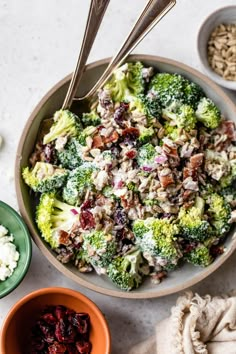 broccoli salad with cranberries and raisins in a bowl