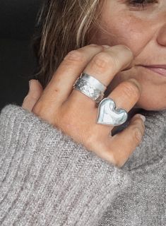 This beautifully chunky sterling silver heart ring features a large lirregularly shaped heart at its centrepiece. m It has been given a sleek high shine, mirror finish for optimum visibility.  ▪️Sterling Silver ▪️Misshapen heart measures 23mm x 23mm ▪️Various sizes available  ▪️The ring will be presented in attractive Scraffs packaging