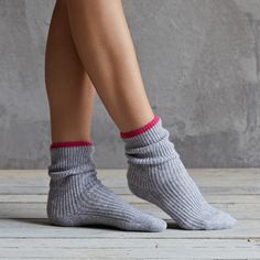 New this season, these super soft 100% cashmere bed socks are the ultimate luxurious addition to your lounge wear.  With a soft grey and pink trim, you can stay cosy in style.Also available in pink. 100% cashmerehand wash or delicate wool cycle at 30 degrees