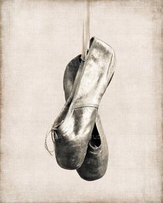 an old pair of shoes hanging from a rope