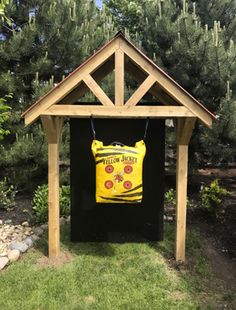 a wooden structure with a yellow sign on it