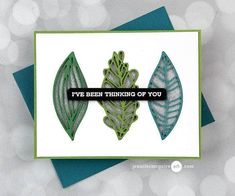 a card with two green leaves and the words i've been thinking of you