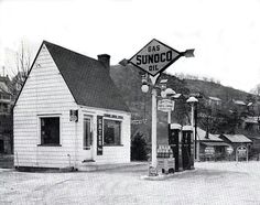 black and white photograph of an old gas station