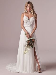 a woman in a white dress holding a bouquet