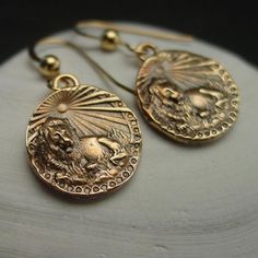 Handmade antiqued dainty birthday gift lion Leo earrings.Handmade antiqued bronze coin charm with the zodiac sign of Leo for people born between July 23- Aug 23.Leo are: Creative, Passionate, Generous, Warm-hearted, Cheerful, HumorousThe concept of the zodiac originated in Babylonian astrology, and was later influenced by Hellenistic culture. According to astrology, celestial phenomena relate to human activity on the principle of "as above, so below", so that the signs are held to represent char Leo Earrings, 2024 Lookbook, Lion Earrings, As Above So Below, Zodiac Birthdays, Magical Jewelry, Coin Earrings, Human Activity, Dope Jewelry