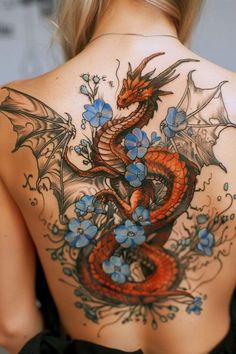 a woman with a dragon tattoo on her back