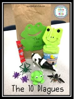 the 10 plagues are in front of a paper bag with an image of a frog on it