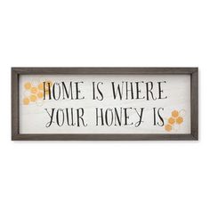 a sign that says home is where your honey is