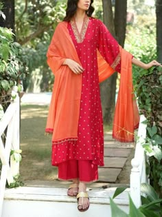 Super elegant pink long kameez with delicate resham thread work match with self colour palazo pant with contrast orange dupatta is perfect for diwali, wedding and party.Comfortable yet stylish trendy Palazzo dupatta suit. ✨Kameez Beautiful pink long kameez has resham thread embroidered over the neck, sleeves and small motif all over the front. ✨Bottom Matching self colour Palazzo pant ✨Dupatta Orange dupatta will have embroidery on two sides, with tassels. ✨We stitched outfit with lot of care, s V Neck Salwar Suit, V Neck Dress Indian, V Neck Kurta Set, V Neck Indian Dress, V Neck Salwar Designs, V Neckline Kurti, Kurti V Neck Designs, V Neck Kurta Design, V Neck Kurti Design Indian