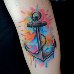 an anchor tattoo on the arm with watercolor splatters and paint splashs