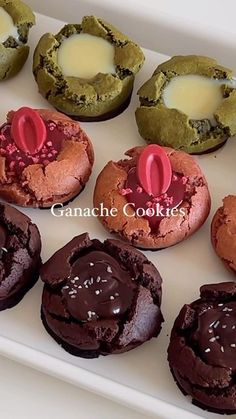 chocolate and green cookies with candles in the middle on a white platter, ready to be eaten