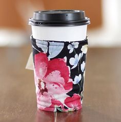 a coffee cup sitting on top of a wooden table