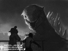 two people standing next to a giant monster