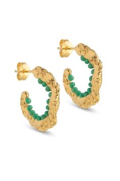 Enora hoops are in a class of their own. From the front it looks like a cool, raw and chunky hoop, but if you see it from the side view you will notice the row of enamel balls placed on the inside of the hoop in the loveliest green colour or blue colour. The Enora earrings are a pair of elegant statement hoops, and they will without a doubt stand out between your other jewellery. Quality: 18k gold-plated sterling silver/MattDimensions: 20 mm Texture Jewelry, Colorful Earrings, Grass Green, Enamel Earrings, Green Enamel, Accessories Jewelry Earrings, Enamel Jewelry, Silver Enamel