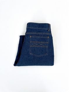 "Vintage 70's Farah Jeans, Straight Leg, Short Denim (W29) These 1970's Men's Farah Jeans come in a medium blue wash and have a zipper fly, straight leg and back pocket stitching detail. The denim is medium weight and has some stretch. 100% Cotton Made in USA *These jeans are in excellent condition and have been professionally hemmed. *Free shipping within the US, they will go Priority Mail for a quick delivery! Size: (W29\" x L27 1/2\") (Tag Size: 30 x 34) Waist: 29\"  Hips: 34\" Inseam: 27 1/2\" (short) Rise: 11 1/2\" (front) 14\" (back) Leg Opening: 8 1/2\" Weight: 1 pound 10 oz *Follow Freshandswanky on Instagram" Pocket Stitching, Burgundy Shorts, 80s Mens, Vintage Levis Jeans, Short Denim, Wrangler Jeans, Wool Pants, Quick Delivery, Vintage Jeans