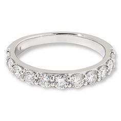 a white gold wedding band with five stones on the side and two rows of diamonds in the middle