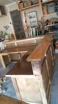 an unfinished wooden counter in a garage