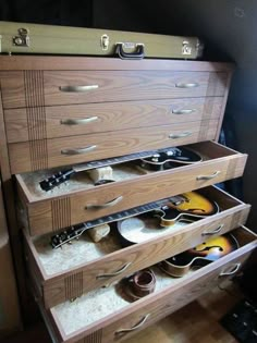 the drawers are filled with guitars and other musical instruments