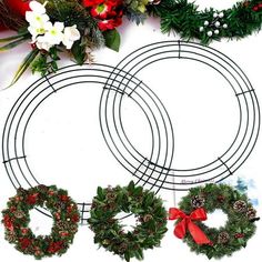 christmas wreaths and other holiday decorations laid out on a table