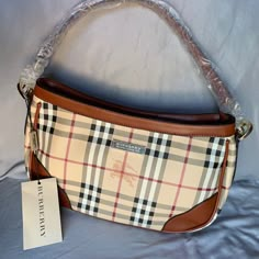 Classic Burberry Print Canvas Medium Tote. Never Used. Versatile Cross Body Strap Included. Zippered Pocket And 2 Other Pockets Inside. Bag Is About 13 X 8 X 3.5 Inches. Burberry Bags Handbags, Vintage Burberry Aesthetic, Burberry Mini Bag, Purses Vintage, Burberry Bag Outfit, Burberry Tote Bag, Burberry Purse, Burberry Shoulder Bag, Purse Outfit