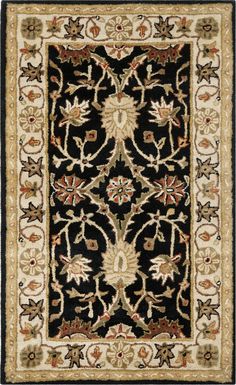 a black and white rug with an ornate design