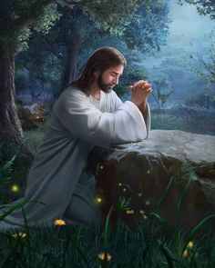 jesus sitting on a rock in the forest praying with his hands clasped over his chest