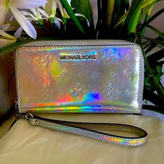 ** Rare** Limited Edition Michael Kors Iridescent Hologram Silver Continental Accordion Zipper Wallet Interior: Center Divider Zippered Pocket, 2 Full Length Slide Compartments And 8 Credit Card Slots Smoke Free Home Look At The Pictures They Are Part Of The Description. Please Check Out My Other Listing For More Bags And Purses. Thanks Measurements Approximate: 4" (H) X 8" (L) X 1" (D) Discounted Shipping Offer / Price Drop Zipper Wallet, Michael Kors Bag, Limited Editions, Card Slots, Credit Card, Zipper Pocket, Bags Designer, Michael Kors, Bag Lady