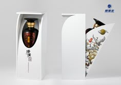 an open box with two bottles inside and one in the shape of a bird on it