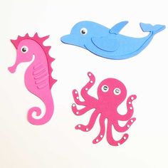 three different types of sea animals on a white background, one pink and one blue