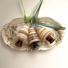 an ornament with shells and ribbons on it