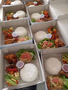 six white boxes filled with different types of food in each one, including rice and meat