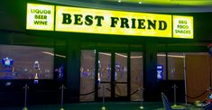 a neon sign that says best friend in front of a restaurant