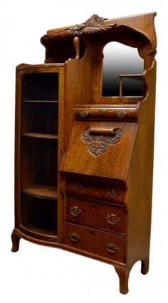 an old fashioned wooden desk with drawers and mirror