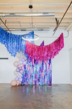 Make your event sparkle with fringe tinsel aerials in bright pink, purple, and turquoise! This colorful, glam setup is perfect for a mom’s wild night or sweet 16 bash. Ideal for planners and hosts wanting a fun, bold look. Discover decor ideas to add flair and excitement to your party atmosphere! Glam Party Decor, Galentines Party