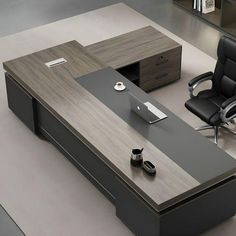 an office desk with two chairs and a laptop on it