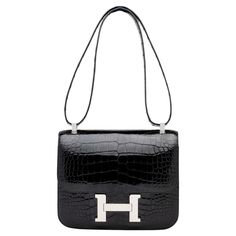 The Hermés bag embodies the quintessence of style and luxury due to its impeccable design, craftsmanship, and significance. That being said, it is the most iconic and desired piece from the Hermés handbag collection. Hermes Crossbody Bag, Black Alligator, Handbag Collection, Hermes Constance, Future Outfit, Hermes Handbags, Hermes Bag, High Jewelry, Kate Spade Crossbody