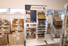 there are many different types of flooring in the store, including wood and tile