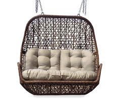 a hanging swing chair with cushions and chains