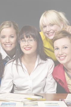 three women are posing for the camera in front of papers