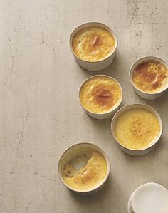 six small bowls filled with food on top of a table